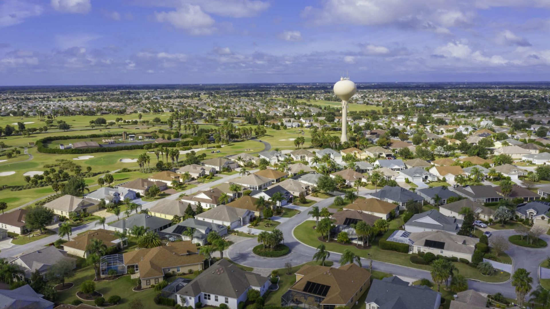 Drone view of residential neighborhood and golf course located in The Villages, a retirement and golfing community in Florida.